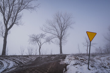 give way sign at a side road