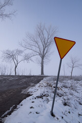 give way sign at a side road