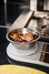 A portion of cooked meat is presented with rich color and texture, showcasing its juicy, tender, and flavorful quality.