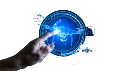 Human hand interacting with a digital drone hologram within a glowing futuristic interface