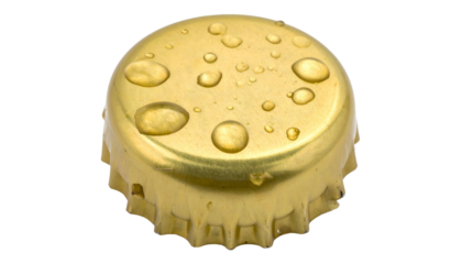Close-up of a golden bottle cap with water droplets against a black background