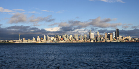 Panorama of Seattle city wide skyline across Elliott Bay in sunshine