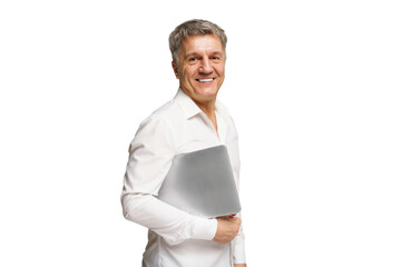 Man smiling while holding a laptop in his arm