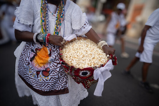 Devotees with Popcorn in a Basket during a Candomble Procession