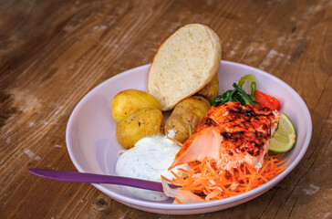 Salmon fillet roasted over an open fire, Zurich Christmas market in Switzerland
