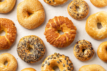 Variety of fresh bagels flat lay composition