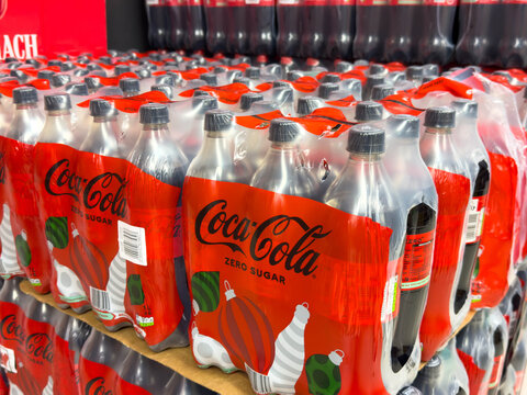 Villach, Austria - December 10, 2025: Coca-Cola Zero Sugar bottles are neatly arranged on display in a retail store, showcasing vibrant packaging and inviting consumers to enjoy a refreshing beverage