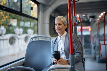 Professional woman enjoying daily commute on public bus