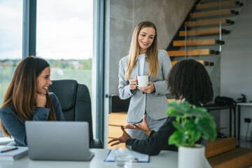 Businesswomen discussing a challenging document with concerned expressions