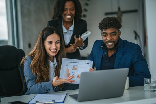 Diverse business team collaborating during data analysis meeting - Powered by Adobe