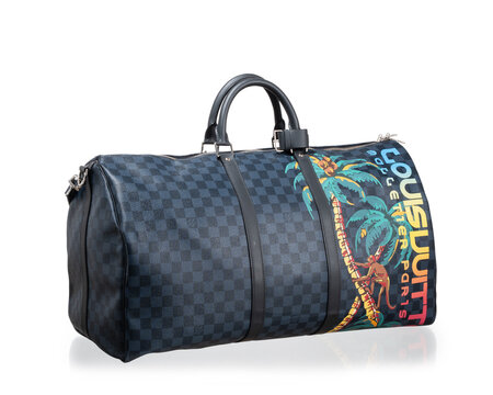 Louis Vuitton bag, model Keepall 55 Bandouli&egrave;re Limited Edition Jungle by Kim Jones, in Damier canvas, photographed on a white background. Milan, Italy, October 3_2025