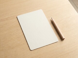 Blank paper and pencil on wooden table for writing