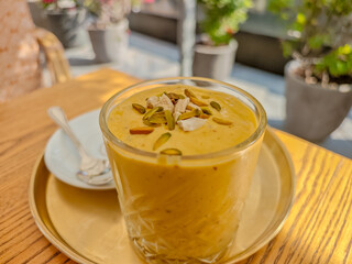 Stylish chilled iced latte served at a Dubai beachfront cafe, modern coffee scene. Modern Dubai beach restaurant