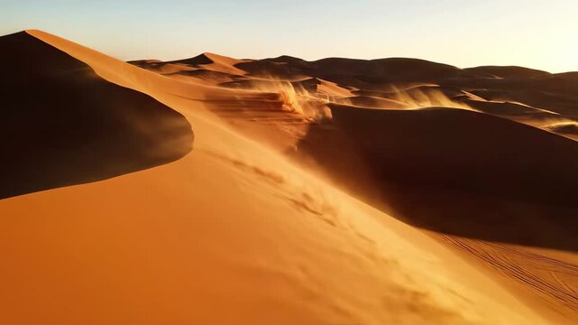 A desert landscape at dawn or dusk, with sunlit sand dunes and blowing dust