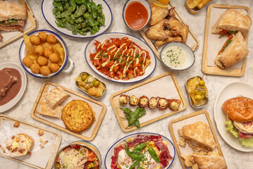 A tribute to the bounty of the sea and the land, where gratinated scallops, razor clams, and cockles share the spotlight with a plate of migas with grapes and a platter of Burgos black pudding.