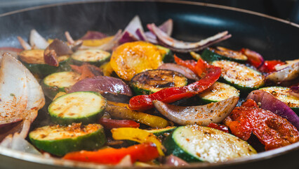 Colorful mix of cucumbers, red onions, mushrooms, and bell peppers sizzling in a pan, releasing steam. Sautéed to perfection—succulent, healthy, and full of natural flavor. Perfect side or main dish.