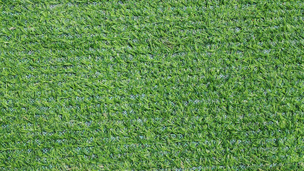 Perfectly Manicured Artificial Turf Background: Vibrant Green Synthetic Grass Texture for Sports and Landscaping