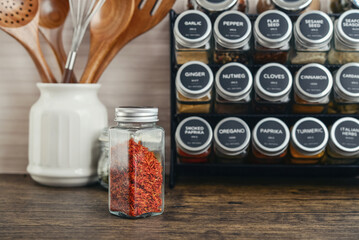 Assorted spices in glass jars with metal lids