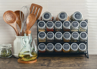 Assorted spices in glass jars with metal lids