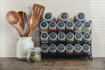 Assorted spices in glass jars with metal lids