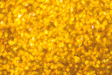 A gold background with many small circles