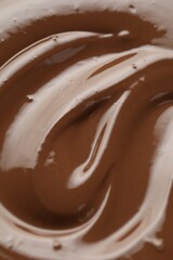 Tasty melted chocolate as background, closeup view