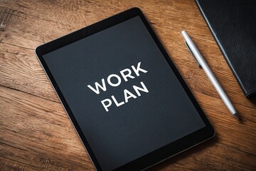 A digital tablet displays a 'Work Plan' on its screen representing effective business strategy and conceptual planning
