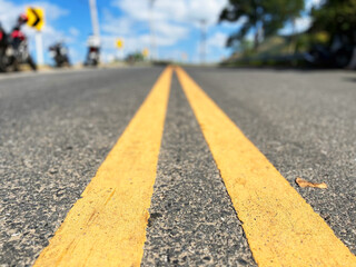 Yellow traffic line color Double solid lines to warn prohibiting overtaking, Yellow continuous tracks of prohibited overtaking painted on the asphalt, Safety driving and traffic regulating rules