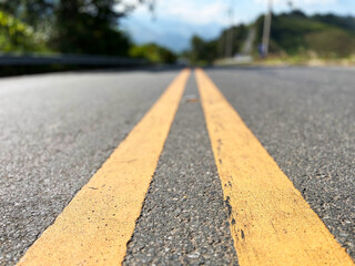 Yellow traffic line color Double solid lines to warn prohibiting overtaking, Yellow continuous tracks of prohibited overtaking painted on the asphalt, Safety driving and traffic regulating rules