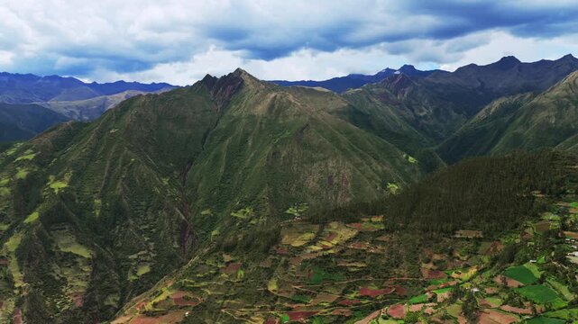 Limatambo mount Humantay Salkantay Peru aerial drone highlands avocado farm crops Peruvian Andes mountain range Cusco region Heertahuayco warm climate Soray rainy season clouds pan left motion