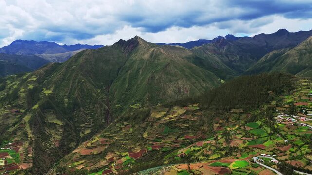 Limatambo Peru aerial drone highlands avocado farm crops Peruvian Andes mountain range Cusco region Heertahuayco warm climate Soray rainy season clouds mount Humantay Salkantay windy road forward
