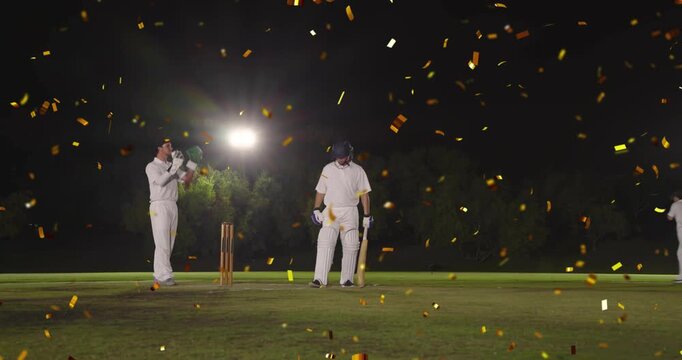 cricket batsman hitting, swing causing gold confetti fall, keeper shifting, prepping next ball