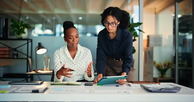 Business women, tablet and advice in office with training, mentor and review for help at night. Employees, people and coaching with journalist, feedback and technology for proposal or agency report