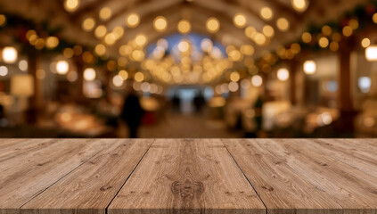Empty wooden table with soft golden holiday market bokeh