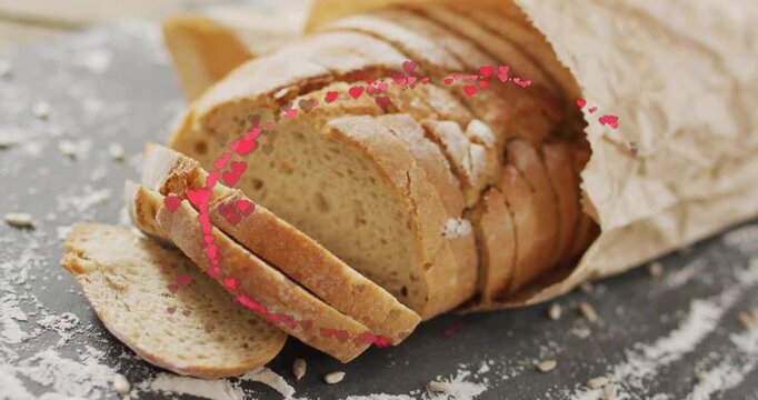 Heart particles entering lower edges, orbiting around rustic loaf, dispersing to highlight bread