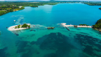 Aerial view of tropical island and boats in Barú, Colombia