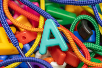 Letter A bead strung on a lace