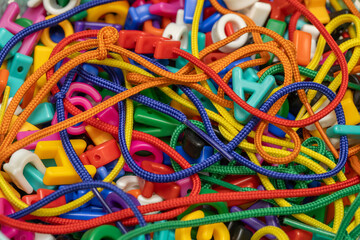 Laces and letter beads in a pile