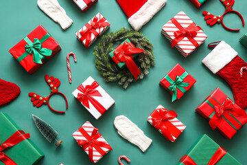 Composition with Christmas gifts and decor on green background