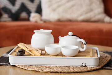 Asian tea set on table in living room, closeup