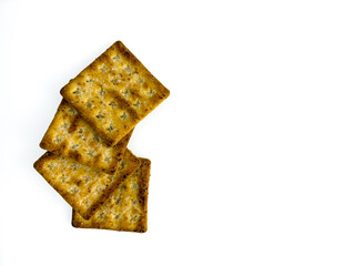 Stack of coconut-flavored sugar crackers isolated on a white background. Crispy baked biscuits known in Indonesia as gabin, popular as a light snack. flat lay and copy space