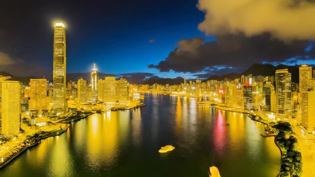 Skyline waterfront dusk reflection illuminated building river calm evening harbor glowing highrise