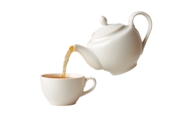 Tea pours from white teapot into a matching teacup