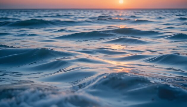 Gentle waves creating silky reflections at sunrise