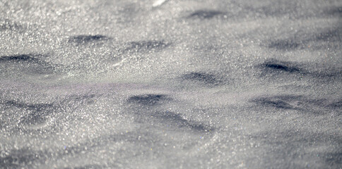 Frozen icy field in natural light. White snow backdrop with cold pattern. Minimal clean winter background.