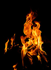 Flame pattern. Flames on black backdrop. Glowing flames on black background. Inferno effect with flame. Blazing fire. Flame abstract design. Intense blazing fire background.