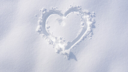 Snow heart. Romantic winter scene. Snow love pattern. Heart shape in snowfall. Winter heart...