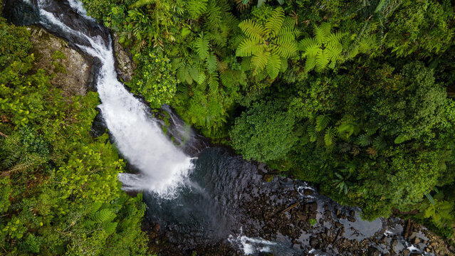 Drone Photo of Waterfall in Dense Forest – Gomblang Waterfall from Above, Java Island, Indonesia - Powered by Adobe