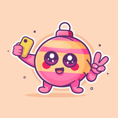 smiling Christmas Ball character mascot taking a selfie with a smartphone isolated cartoon 