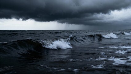 Dark storm clouds loom over turbulent ocean waves under a gloomy sky